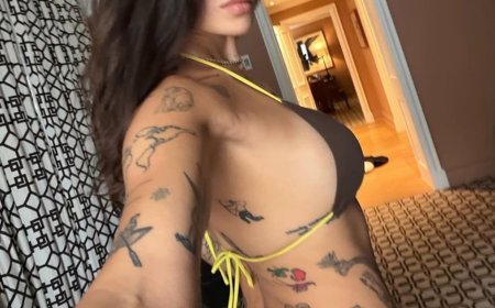 Guess The Tatted Up Musician In This Brown Bikini!