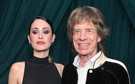 Mick Jagger, 82, wraps an arm around braless fiancee Melanie Hamrick, 38, at starry pre-Oscars bash