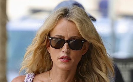 Huge blow for embattled radio stars Kyle and Jackie O - as Henderson cuts a downcast figure on outing in Sydney amid her wrongful termination battle