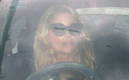 Kyle Sandilands' wife Tegan Kynaston looks tense as she leaves their Vaucluse mansion after the shock jock's bombshell termination