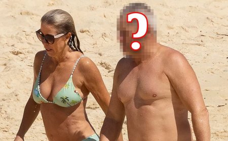 Guess who? Nineties heartthrob strips off and enjoys some fun in the sun with new partner who bears a striking resemblance to his long-term ex