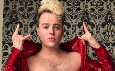 Jedward's John Grimes says trolls commenting on his weight gain amid TV comeback and comparing his physique to pop heyday 'hurts' as he strips off his shirt for empowering post: 'I can't wear skinny jeans 24/7'