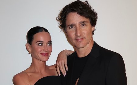Katy Perry and Justin Trudeau pose for loved-up snap with singer sharing a cryptic comment about 'karma' - as his son, 18, heaps praise on their unlikely relationship