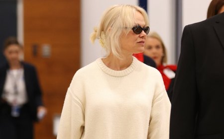 Pamela Anderson looks chic in an all-white ensemble as she touches down in Sydney ahead of her Australian speaking tour