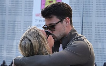 Lottie Moss brushes off her financial concerns as she shares a passionate kiss with boyfriend Themy Kalaitzis at a London pub  - after 'liquidating her company to pay off huge tax bill'