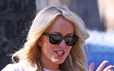 Radio star Jackie 'O' Henderson appears stress free during a relaxed stroll in Sydney's Centennial Park - as court battle continues