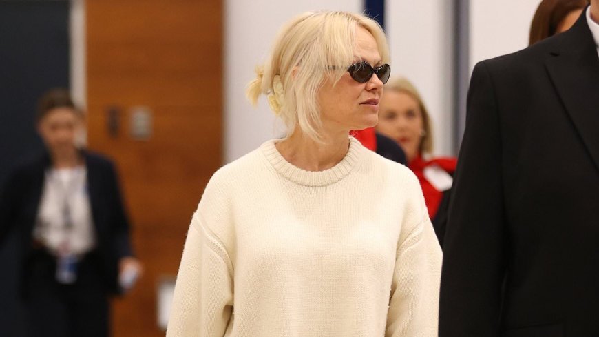 Pamela Anderson looks chic in an all-white ensemble as she touches down in Sydney ahead of her Australian speaking tour