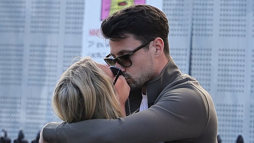 Lottie Moss brushes off her financial concerns as she shares a passionate kiss with boyfriend Themy Kalaitzis at a London pub  - after 'liquidating her company to pay off huge tax bill'