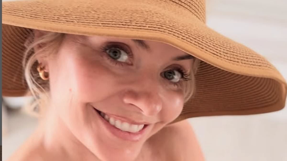 Holly Willoughby showcases her gorgeous figure as she slips into a black bikini while rustling up a salad during record breaking heatwave