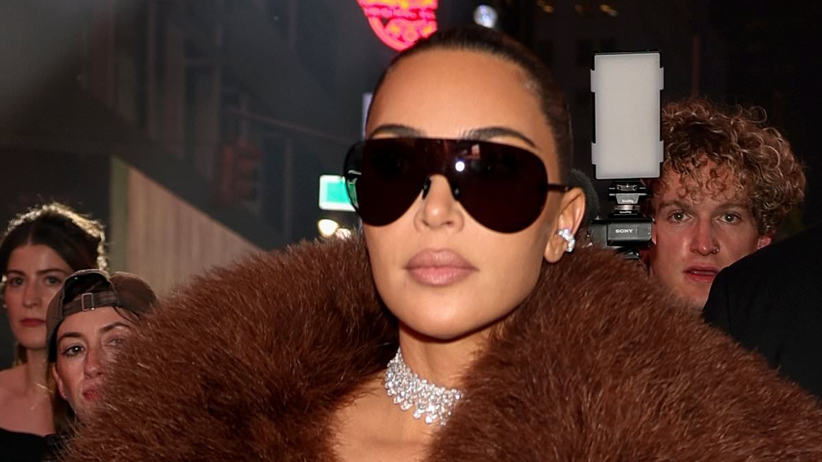 Kim Kardashian roasted over 'ridiculous' outfit at Gucci show as she sits front row with Anna Wintour and Mariah Carey