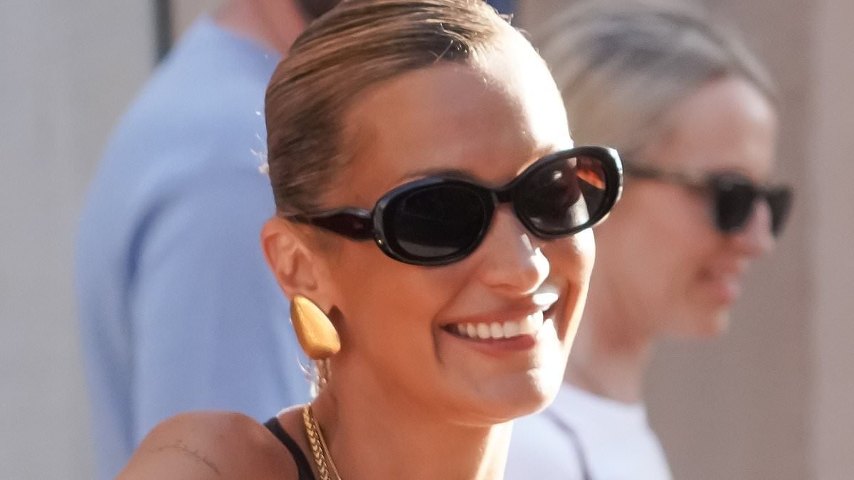 Bella Hadid turns heads in a plunging black dress as she steps out in Saint-Tropez during sun-soaked getaway