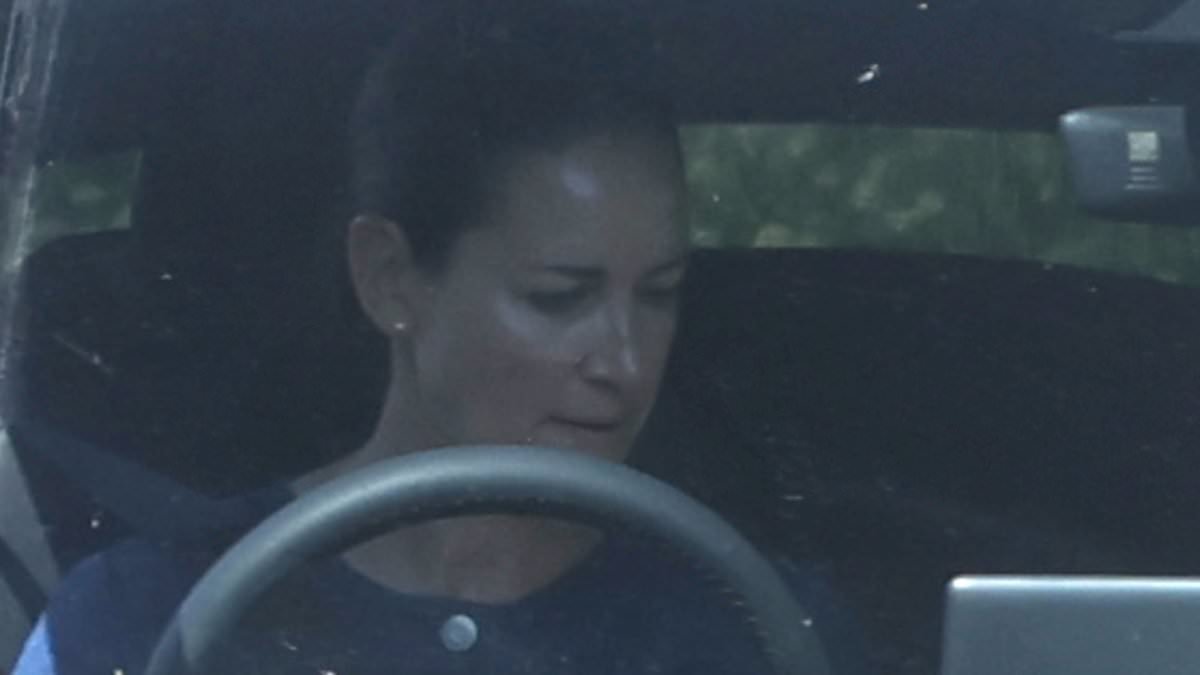 Kirsty Gallacher is seen behind the wheel of her £55,000 Tesla for the first time since serving a six-month driving ban for speeding - her fifth motoring offence in eight years