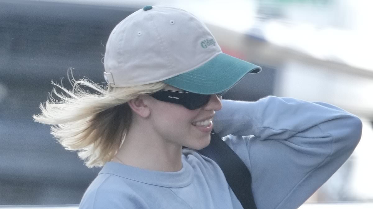 Hollywood star goes incognito as she touches down at Gold Coast Airport with millionaire boyfriend