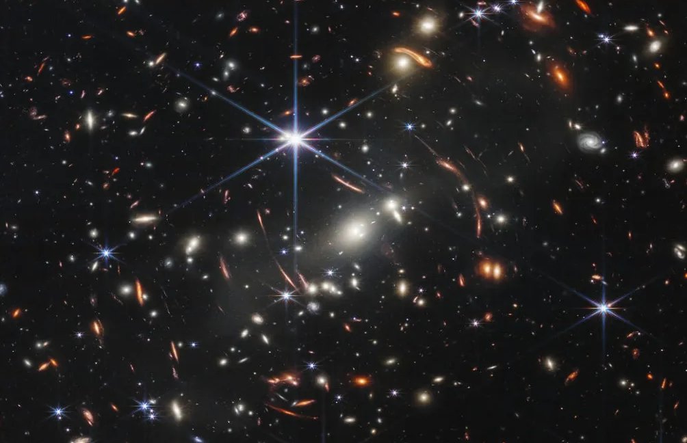Gravitational lens shows a galaxy just 800 million years post-Big Bang