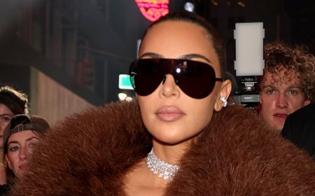 Kim Kardashian roasted over 'ridiculous' outfit at Gucci show as she sits front row with Anna Wintour and Mariah Carey