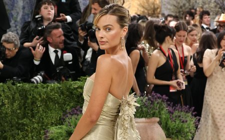 Margot Robbie's Chanel gown is branded 'the biggest disappointment of the Met Gala' before her co-star rushes to her defence