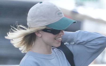 Hollywood star goes incognito as she touches down at Gold Coast Airport with millionaire boyfriend