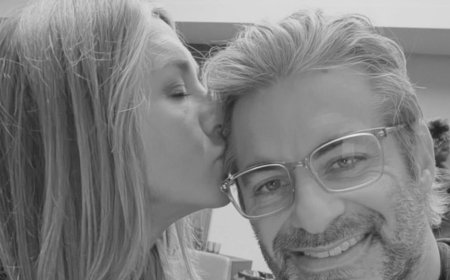 Jennifer Aniston plants kiss on boyfriend Jim Curtis as their one-year anniversary plans are revealed
