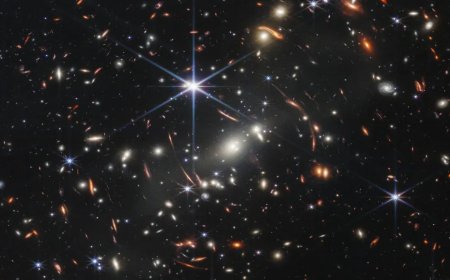 Gravitational lens shows a galaxy just 800 million years post-Big Bang