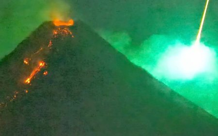 Spectacular Moment Meteor Explodes Behind Erupting Volcano Caught on Camera