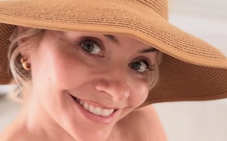 Holly Willoughby showcases her gorgeous figure as she slips into a black bikini while rustling up a salad during record breaking heatwave
