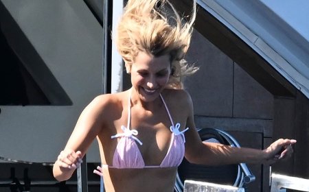 Bella Hadid shows off her supermodel figure in a pink bikini as she cools off on a luxury yacht while taking a break from the Cannes Film Festival