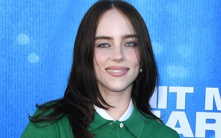 Billie Eilish rocks signature baggy quirky style at her film premiere after admitting to 'gender euphoria' when wearing men's clothes
