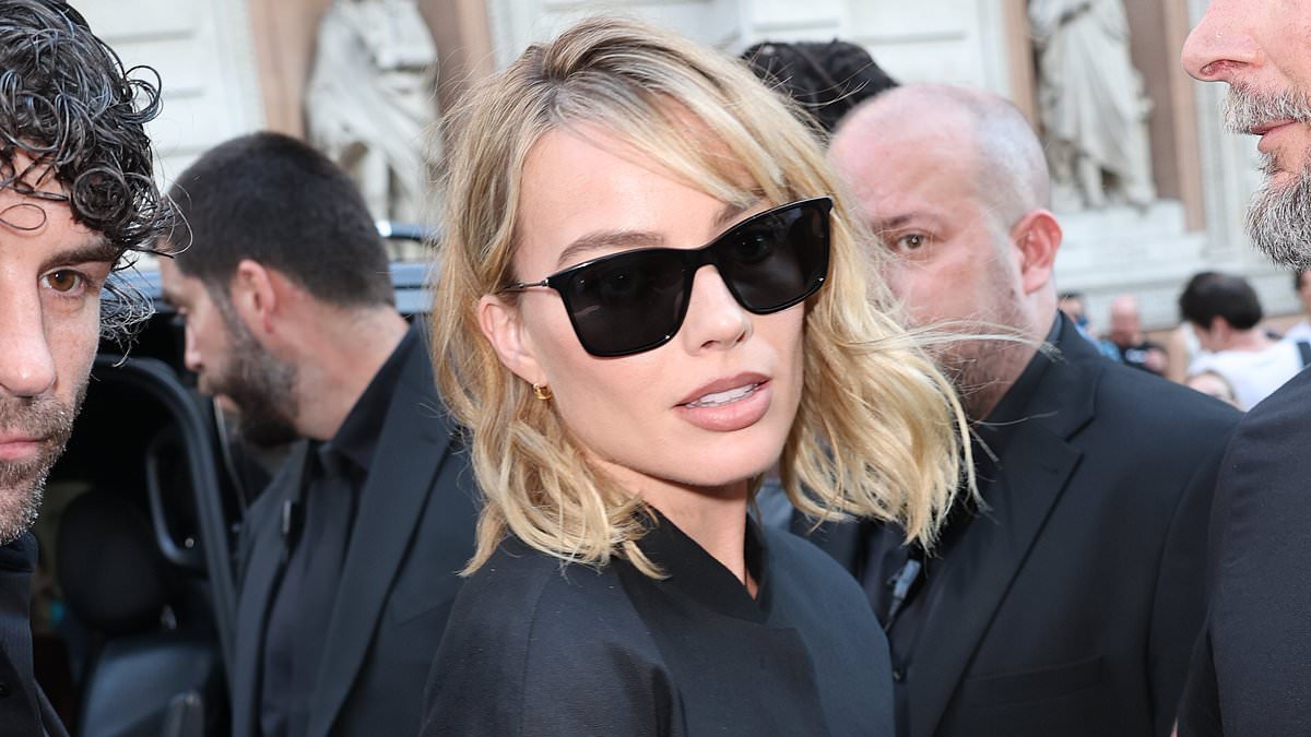 Margot Robbie ignores the UK heatwave in covered up look as she joins Janet Jackson at star-studded RH London launch party