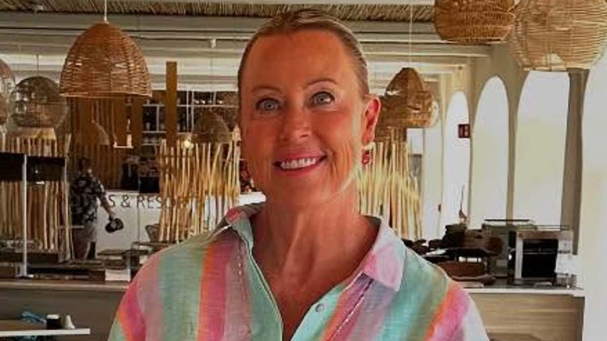 Lisa Curry suffers 'packer's regret' as she wheels luggage jam-packed with 'outfits of the day' through the airport - and reveals her travel hack