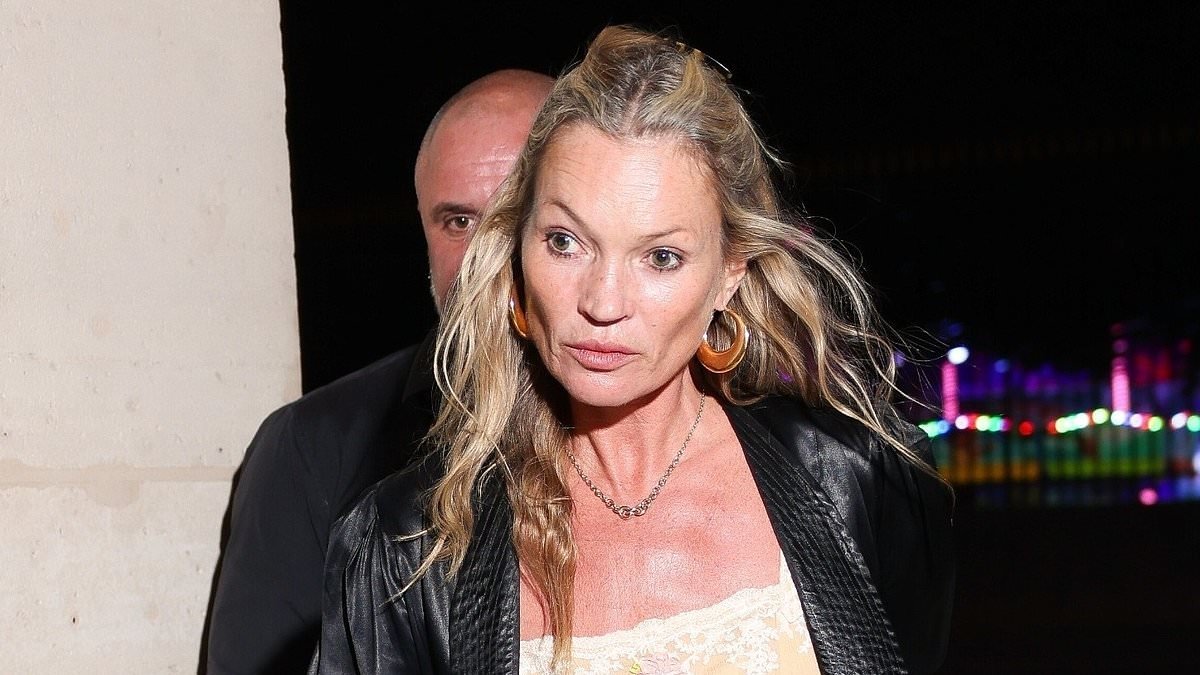 Kate Moss, 52, shows off her supermodel legs in leather hotpants as she's given a helping hand by security while stepping out in Paris
