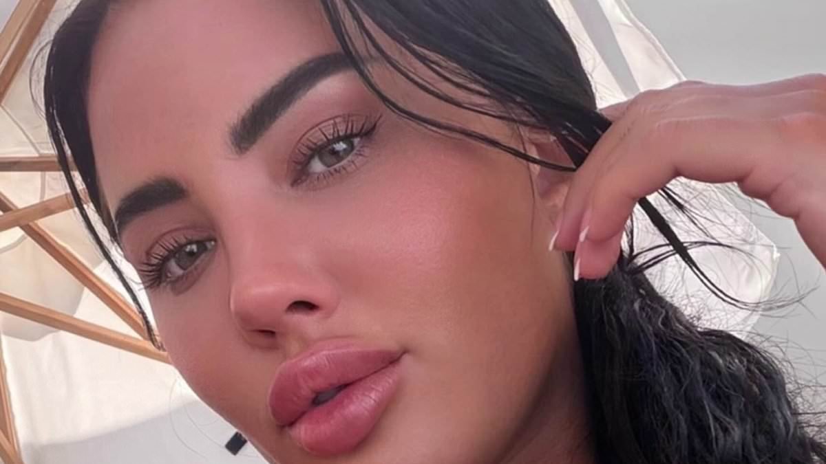 Yazmin Oukhellou flaunts her surgically enhanced assets and toned physique in VERY skimpy bikini as she enjoys Spanish holiday