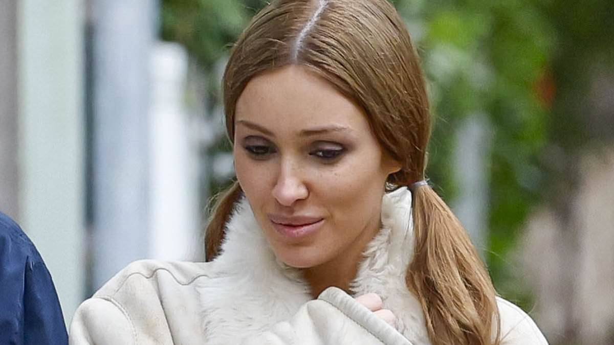 Bianca Censori giggles with her sister as she steps out for a rare family outing in Melbourne - days after being snapped sullen and half-naked with Kanye West in LA