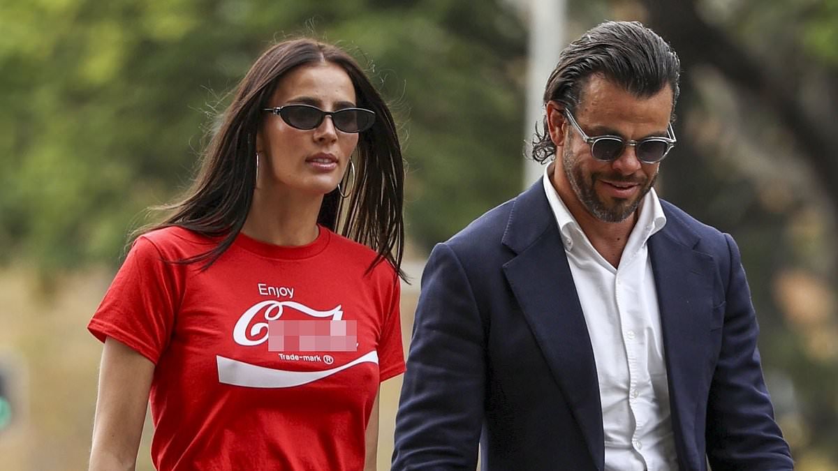 Indy Clinton shocks onlookers as she arrives at Federal Court in X-rated T-shirt alongside husband Ben Azar as he sues his former employer for alleged unfair dismissal