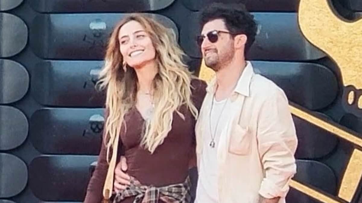 Paris Jackson sparks romance rumours as she puts on a cosy red carpet display with a mystery man at Jackass premiere one year after ending her engagement