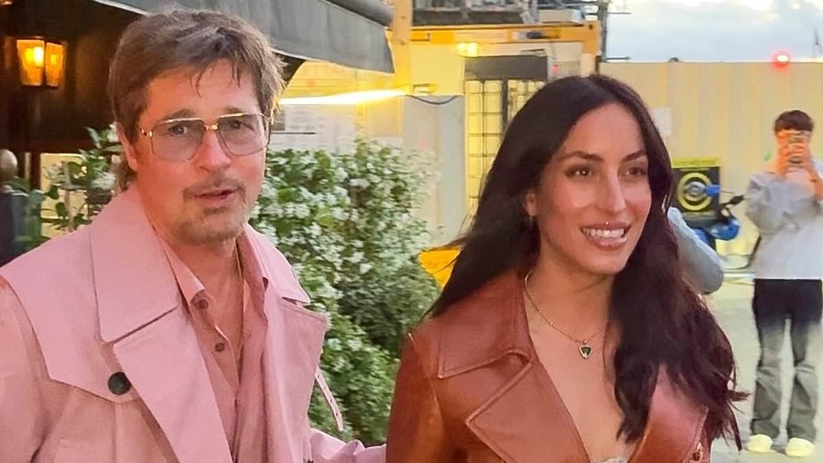 Brad Pitt, 62, steals the spotlight from girlfriend Ines de Ramon, 33, in a bold pink coat as couple continue romantic weekend in Paris with cosy dinner date