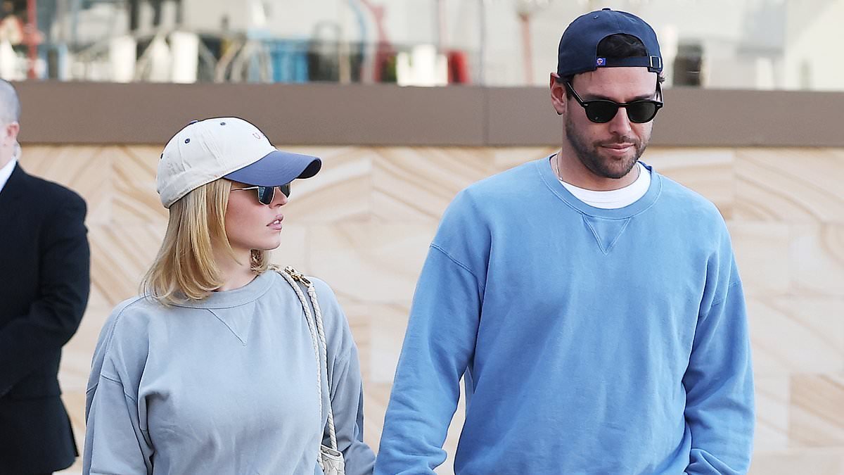 Sydney Sweeney jumps into Scooter Braun's arms as the couple pack on the PDA during Sydney stroll