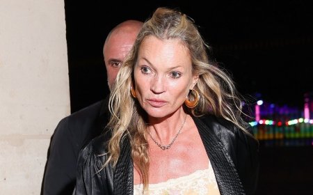 Kate Moss, 52, shows off her supermodel legs in leather hotpants as she's given a helping hand by security while stepping out in Paris
