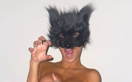 Kanye West shares TOPLESS photo of wife Bianca Censori posing in a cat mask after she stepped out with no underwear in a very sheer gown