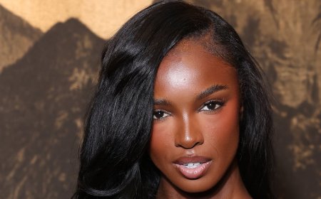 Braless Leomie Anderson sizzles in a sheer lace maxi dress as she attends PFW show after saying she loves wearing flesh-flashing looks