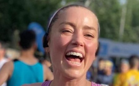 Johnny Depp's ex Amber Heard gives rare glimpse of daughter Oonagh, five, after finishing 10k race in Spain