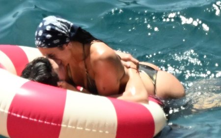 Bikini-clad Dua Lipa and new husband Callum Turner can't keep their hands off each other as they pack on the PDA in steamy photos during lavish Amalfi coast honeymoon