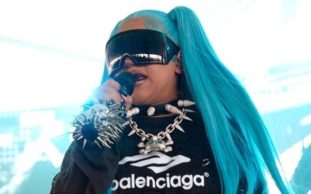 North West, 12, takes the stage in spiked choker and blue pigtails at VERY rowdy music festival… as she gets dad Kanye's stamp of approval