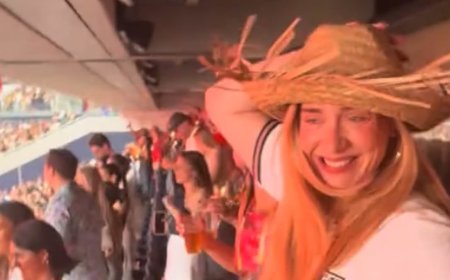 Adele steals fan's hat and shows off her dance moves in an England shirt as she enjoys wild night with Rich Paul at Bad Bunny's star-studded London gig