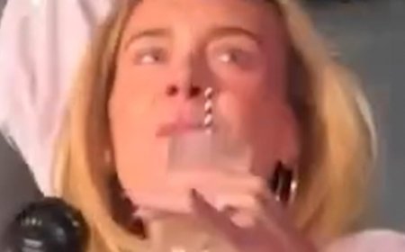 Margot Robbie blends in with concertgoers as she wears a baseball T-shirt and tiny shorts while partying at the Bad Bunny concert in London