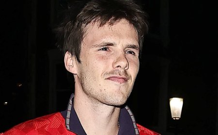 Cruz Beckham takes a subtle swipe at Brooklyn as he pays tribute to dad David's iconic England '7' shirt while partying with Jackie Apostel and an A-list crowd at star-studded World Cup bash