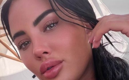 Yazmin Oukhellou flaunts her surgically enhanced assets and toned physique in VERY skimpy bikini as she enjoys Spanish holiday
