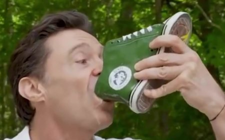 Hughie does a shoey! Wolverine star and bestie Ryan Reynolds drink beer from a sneaker