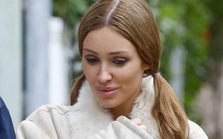 Bianca Censori giggles with her sister as she steps out for a rare family outing in Melbourne - days after being snapped sullen and half-naked with Kanye West in LA