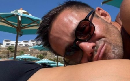 Spencer Matthews kisses pregnant wife Vogue Williams' bikini-clad bump as they pack on the PDA during lavish £600-a-night Mykonos babymoon