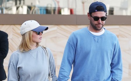 Sydney Sweeney jumps into Scooter Braun's arms as the couple pack on the PDA during Sydney stroll